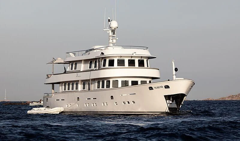 a large white boat in the water aboard TANANAI Yacht for Sale