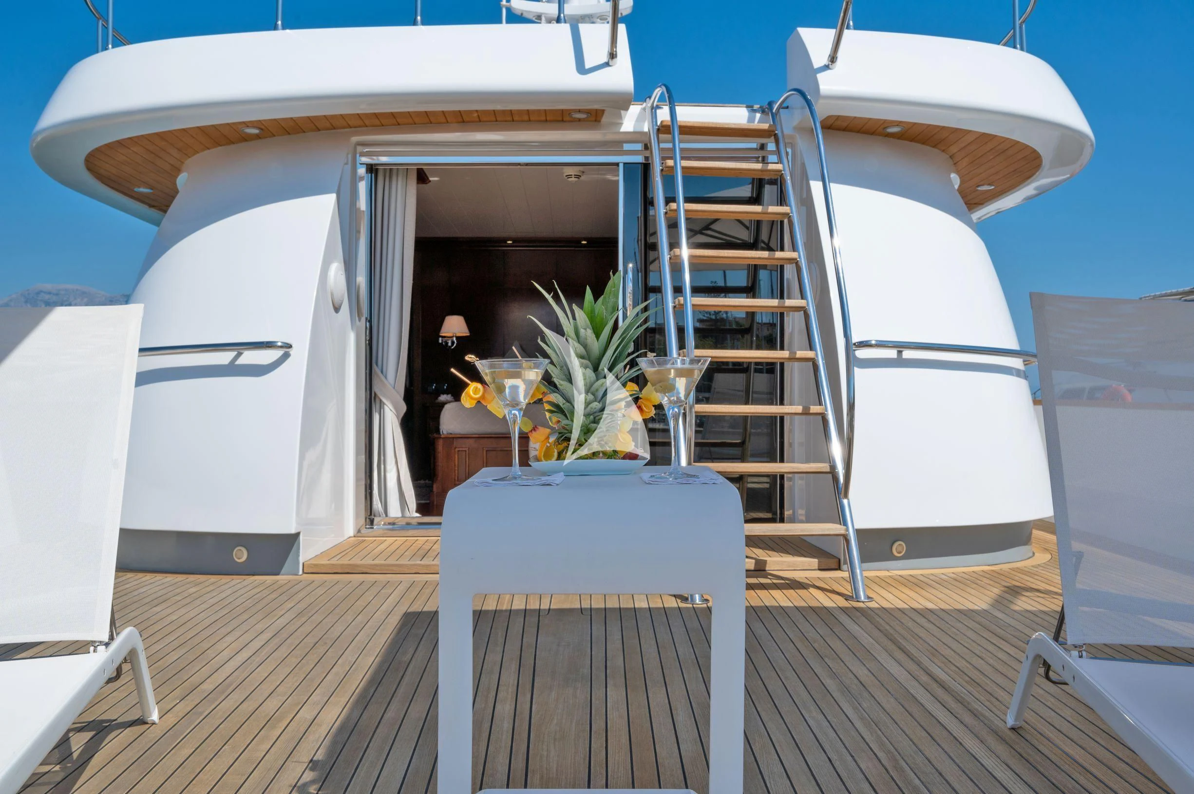 a room with a table and chairs aboard TANANAI Yacht for Sale