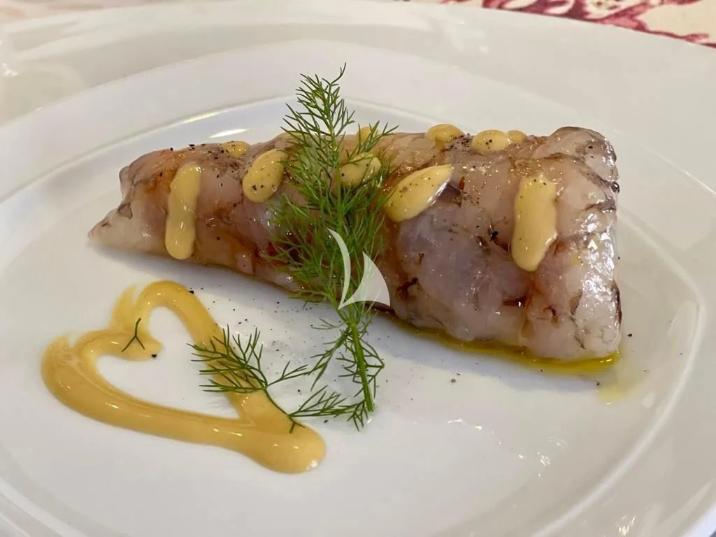 a plate of food aboard TANANAI Yacht for Sale