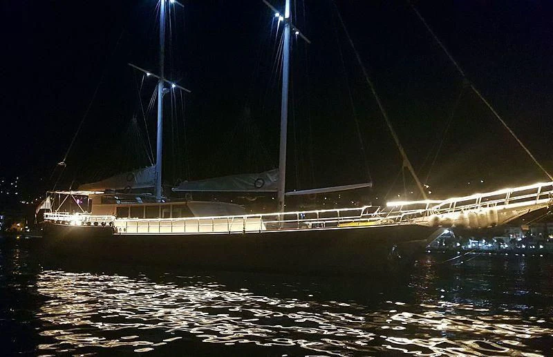 a large ship at night aboard WHITE SWAN Yacht for Sale