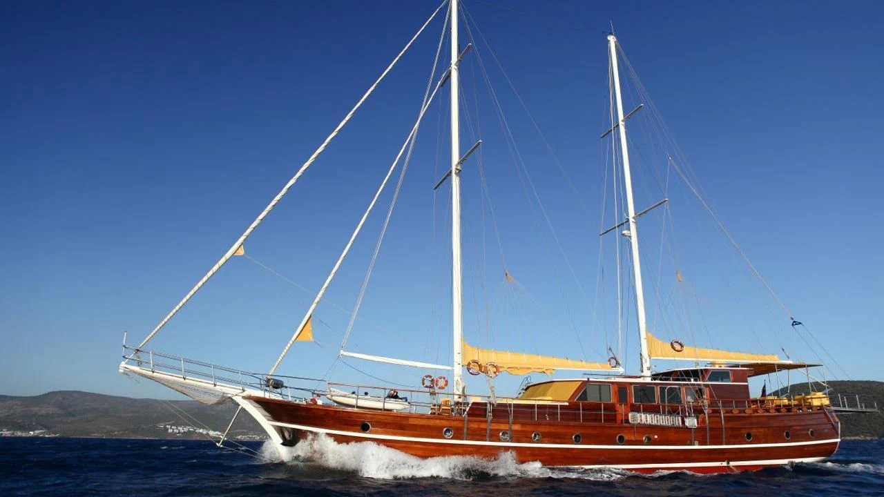 a large boat in the water aboard WHITE SWAN Yacht for Sale