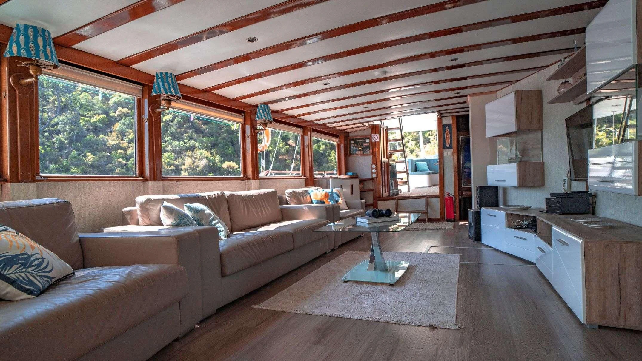a living room with a large ceiling aboard WHITE SWAN Yacht for Sale