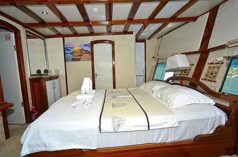 a room with two beds aboard WHITE SWAN Yacht for Sale
