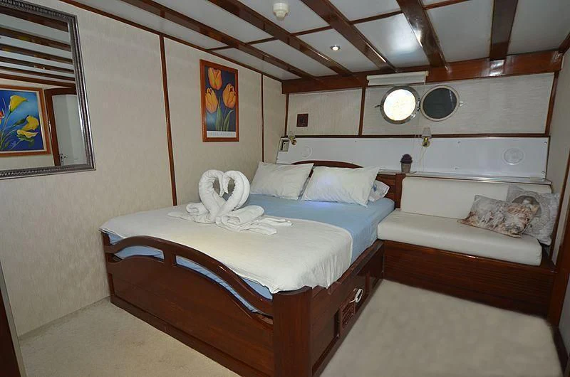 a room with two beds aboard WHITE SWAN Yacht for Sale