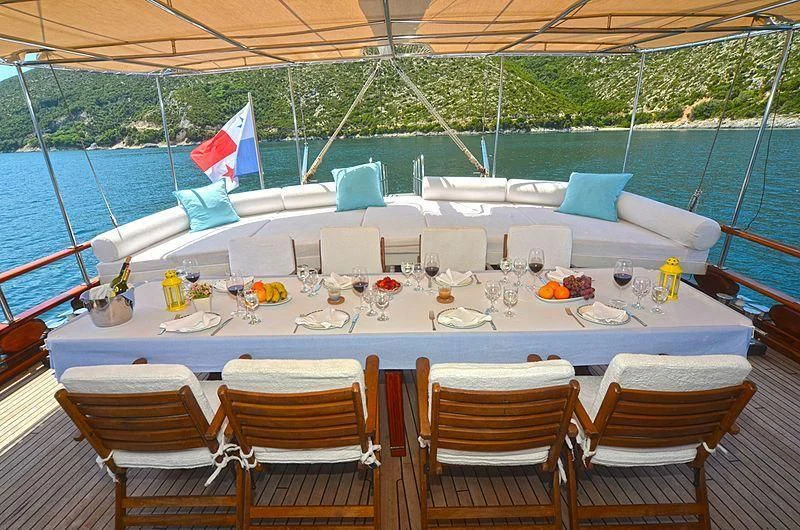a table set for a dinner party aboard WHITE SWAN Yacht for Sale