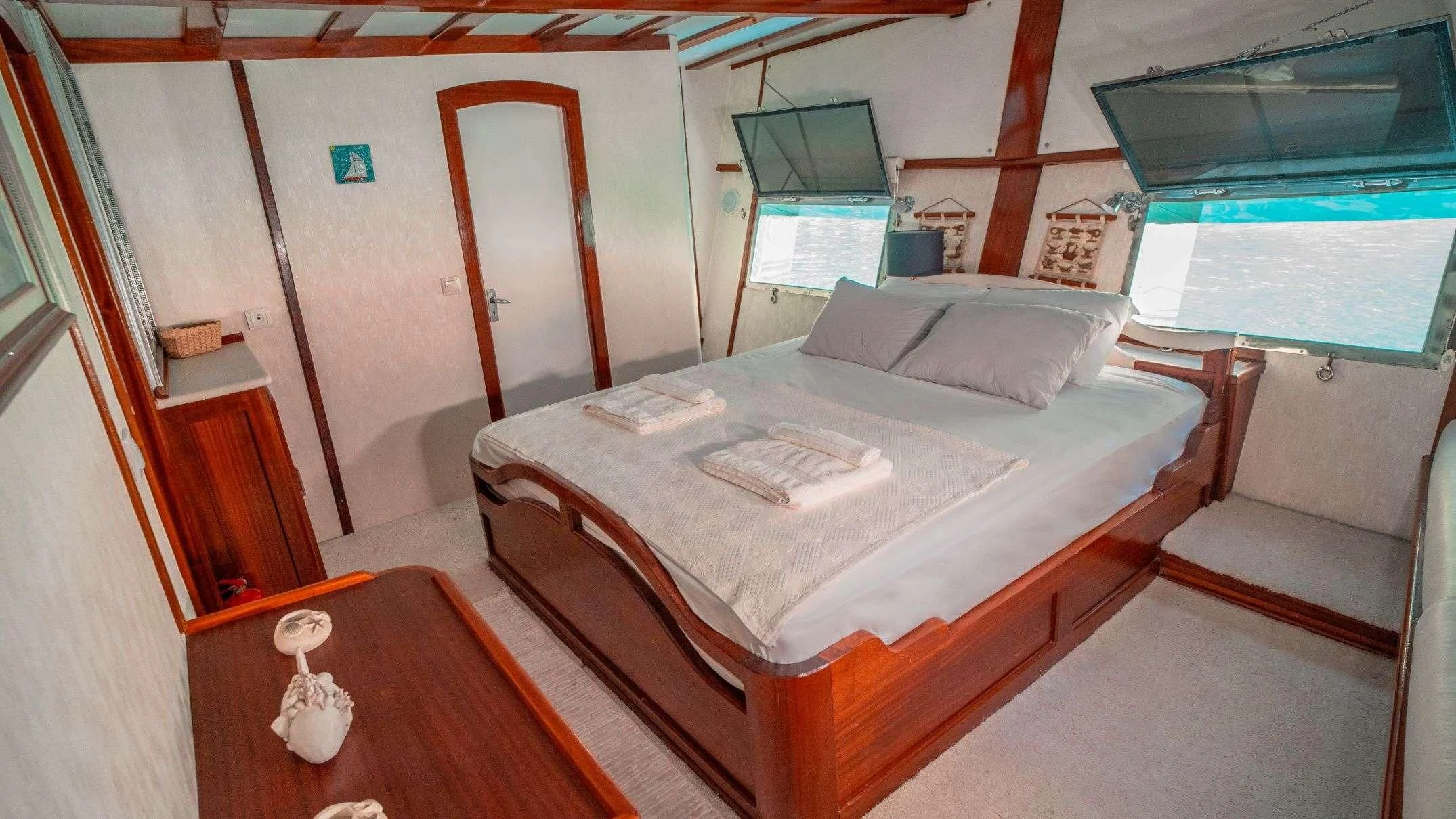a bed in a room aboard WHITE SWAN Yacht for Sale