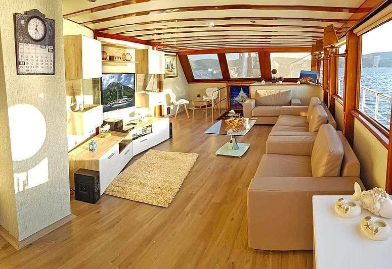 a living room with a large window aboard WHITE SWAN Yacht for Sale