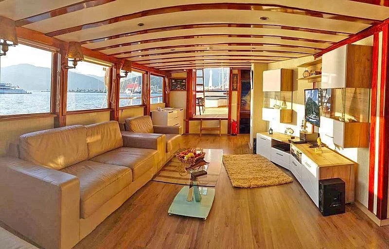 a living room with a couch and a coffee table aboard WHITE SWAN Yacht for Sale