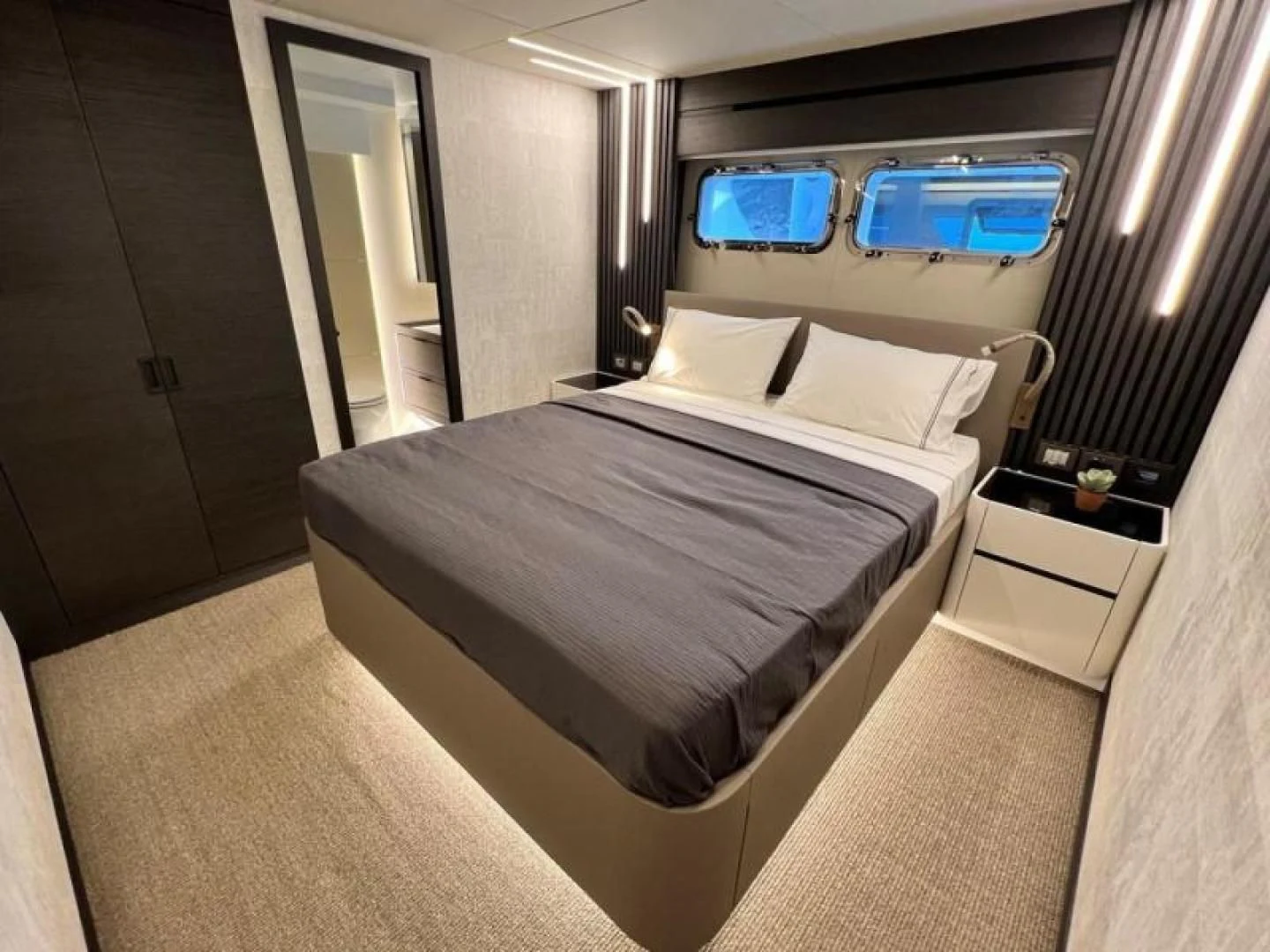 a bed in a room aboard NUMARINE 22XP/07 Yacht for Sale