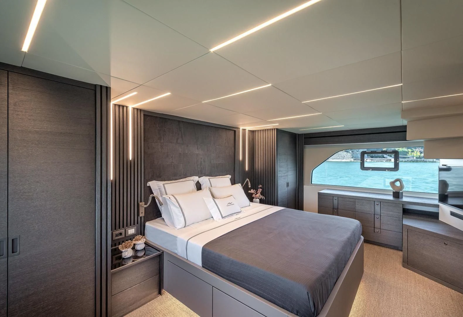 a room with a bed and a window aboard NUMARINE 22XP/07 Yacht for Sale