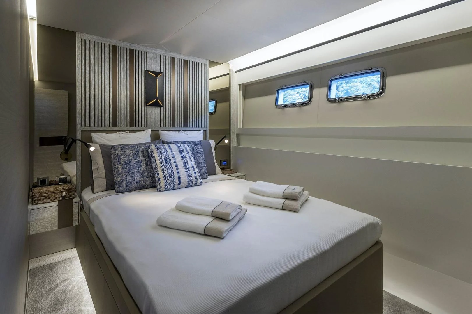 a bed with a white bed spread aboard NUMARINE 22XP/07 Yacht for Sale