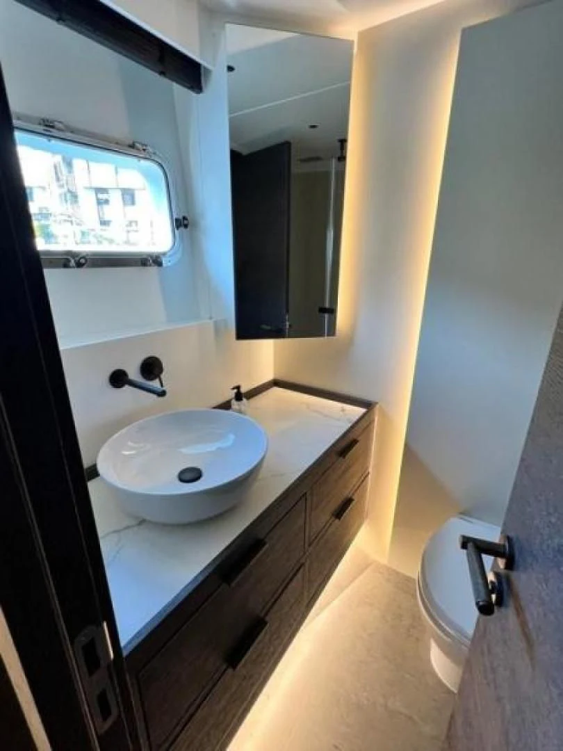 a bathroom with a sink and a mirror aboard NUMARINE 22XP/07 Yacht for Sale