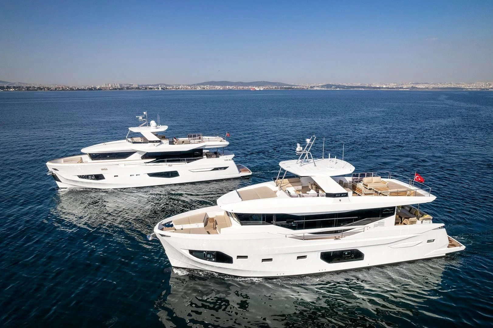 a couple of white boats in the water aboard NUMARINE 22XP/07 Yacht for Sale