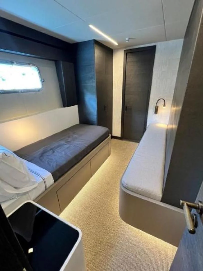 a room with a bed and a window aboard NUMARINE 22XP/07 Yacht for Sale