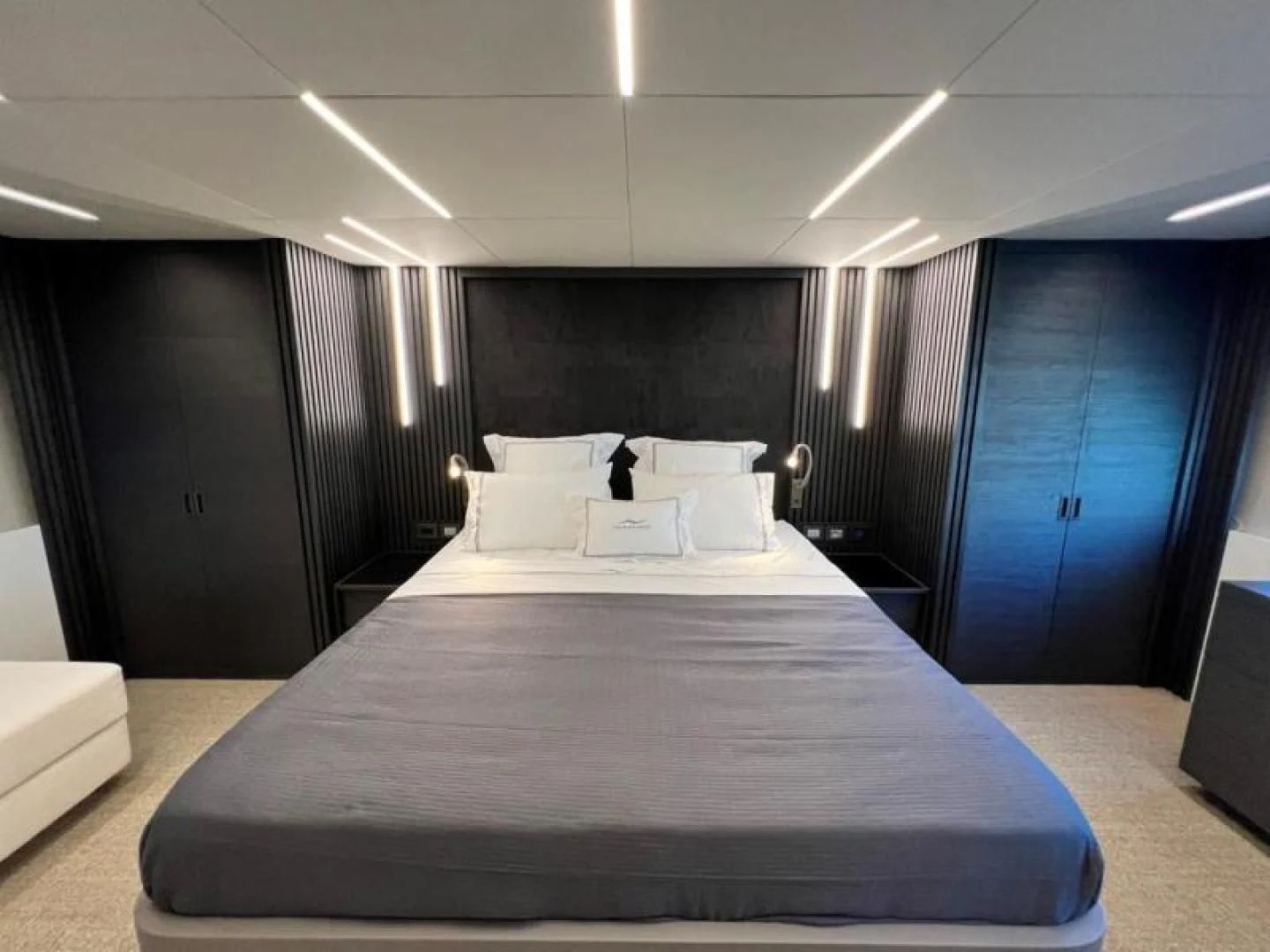 a room with a bed and a desk aboard NUMARINE 22XP/07 Yacht for Sale