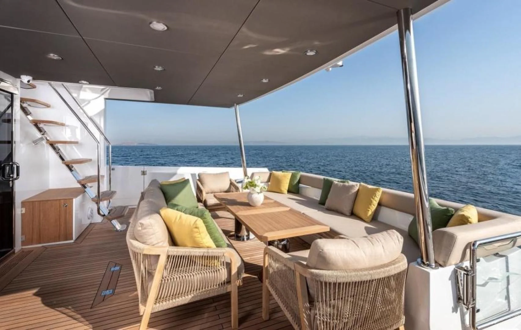 a room with a couch and a table and chairs aboard NUMARINE 22XP/07 Yacht for Sale