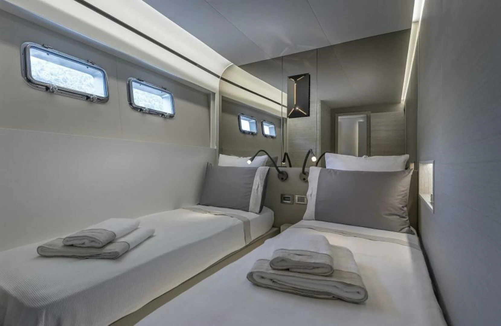a room with beds and a window aboard NUMARINE 22XP/07 Yacht for Sale