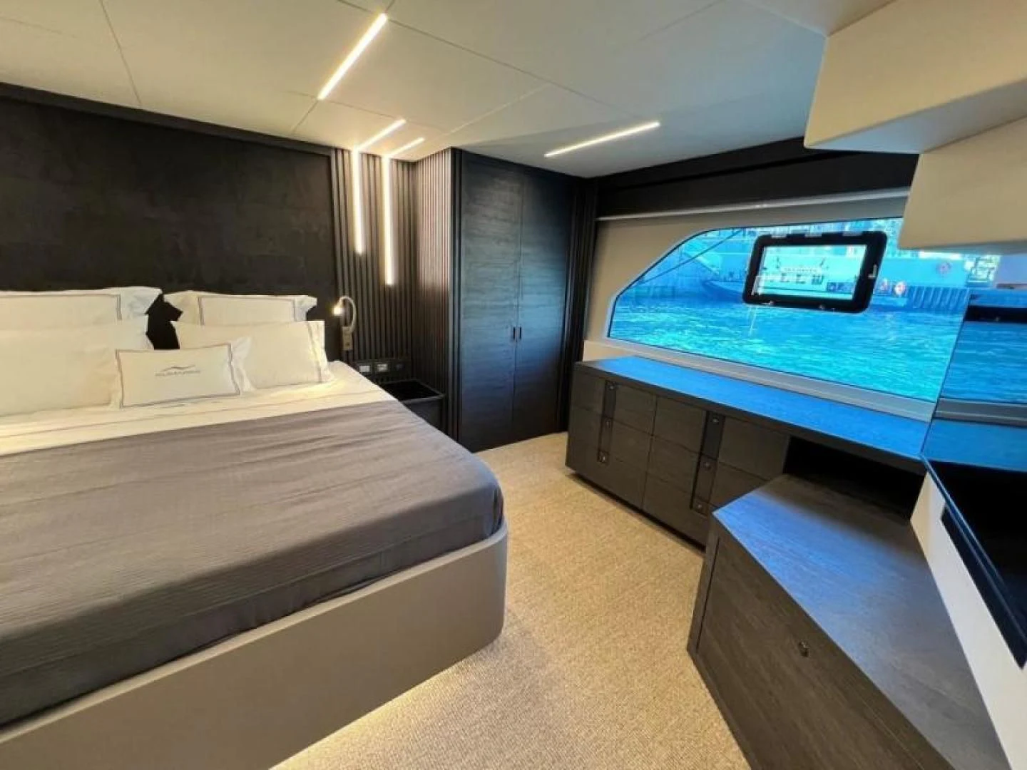 a room with beds and a tv aboard NUMARINE 22XP/07 Yacht for Sale