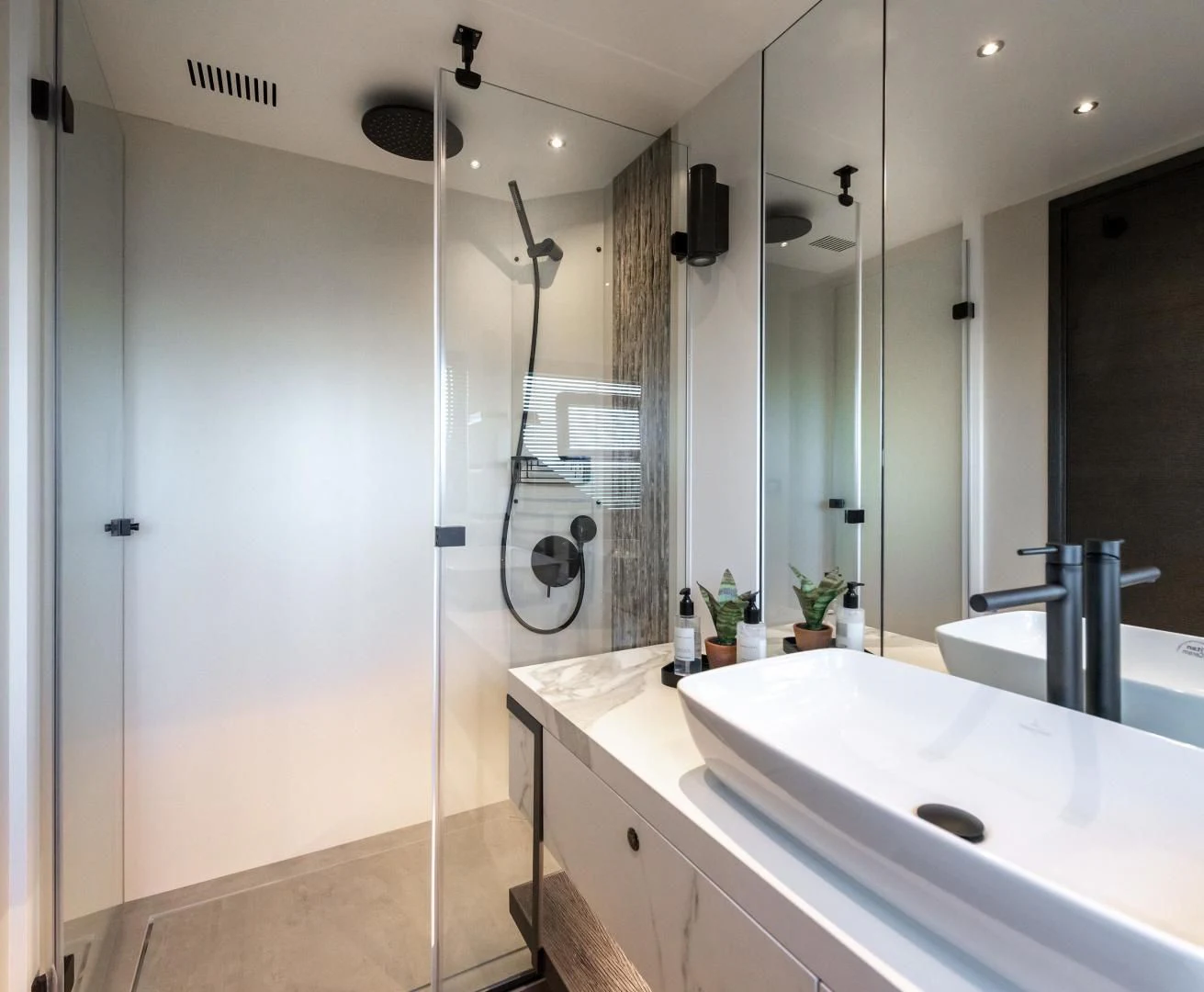 a bathroom with a glass shower aboard NUMARINE 22XP/07 Yacht for Sale