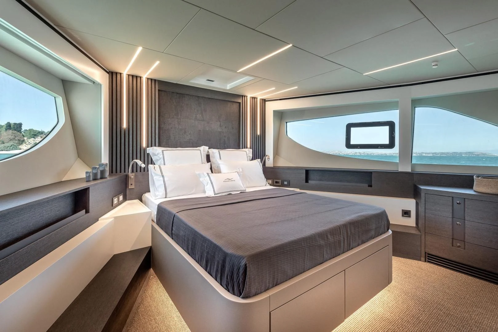 a room with a bed and a window aboard NUMARINE 22XP/07 Yacht for Sale