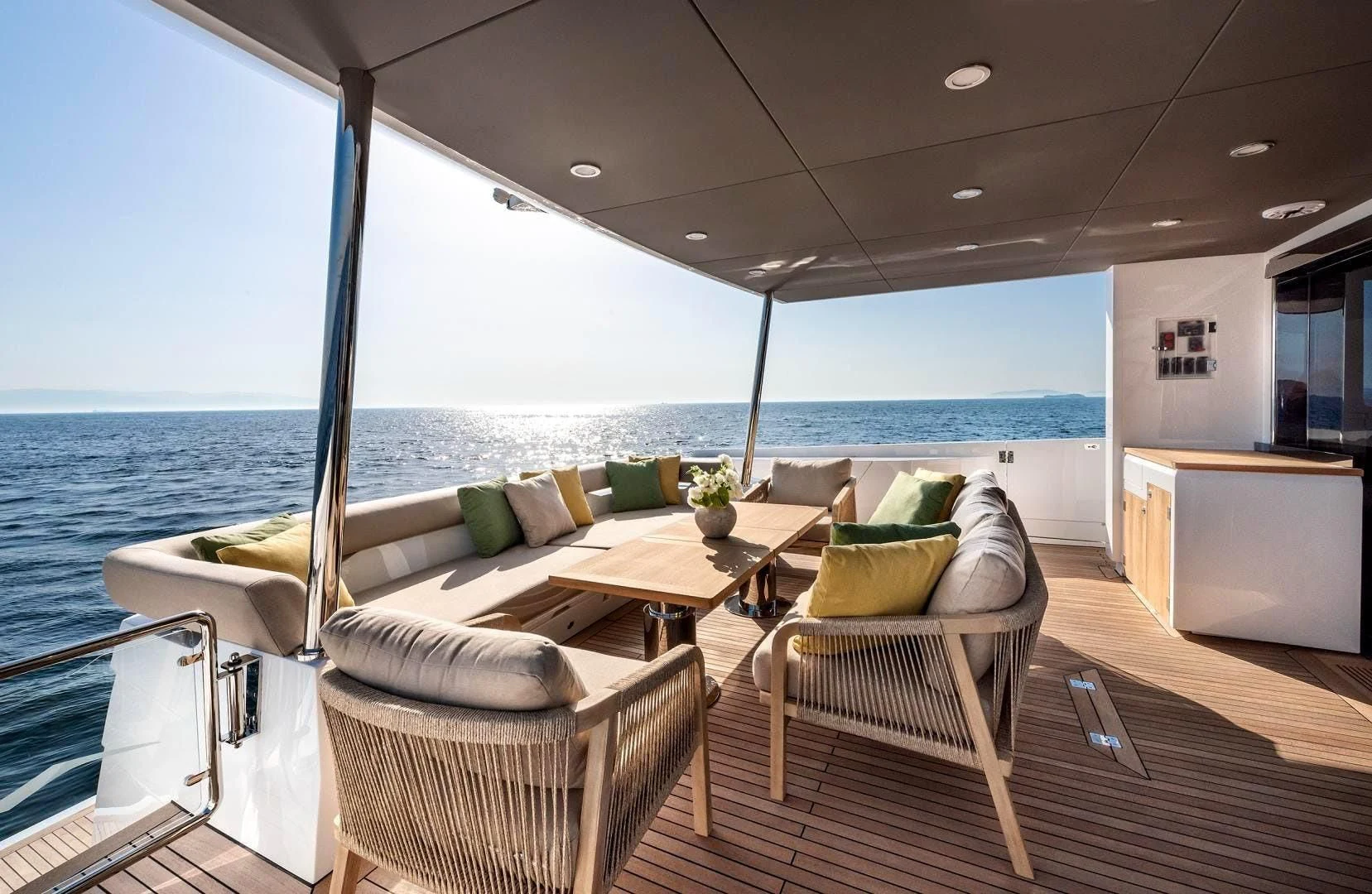 a living room with a large balcony overlooking the ocean aboard NUMARINE 22XP/07 Yacht for Sale