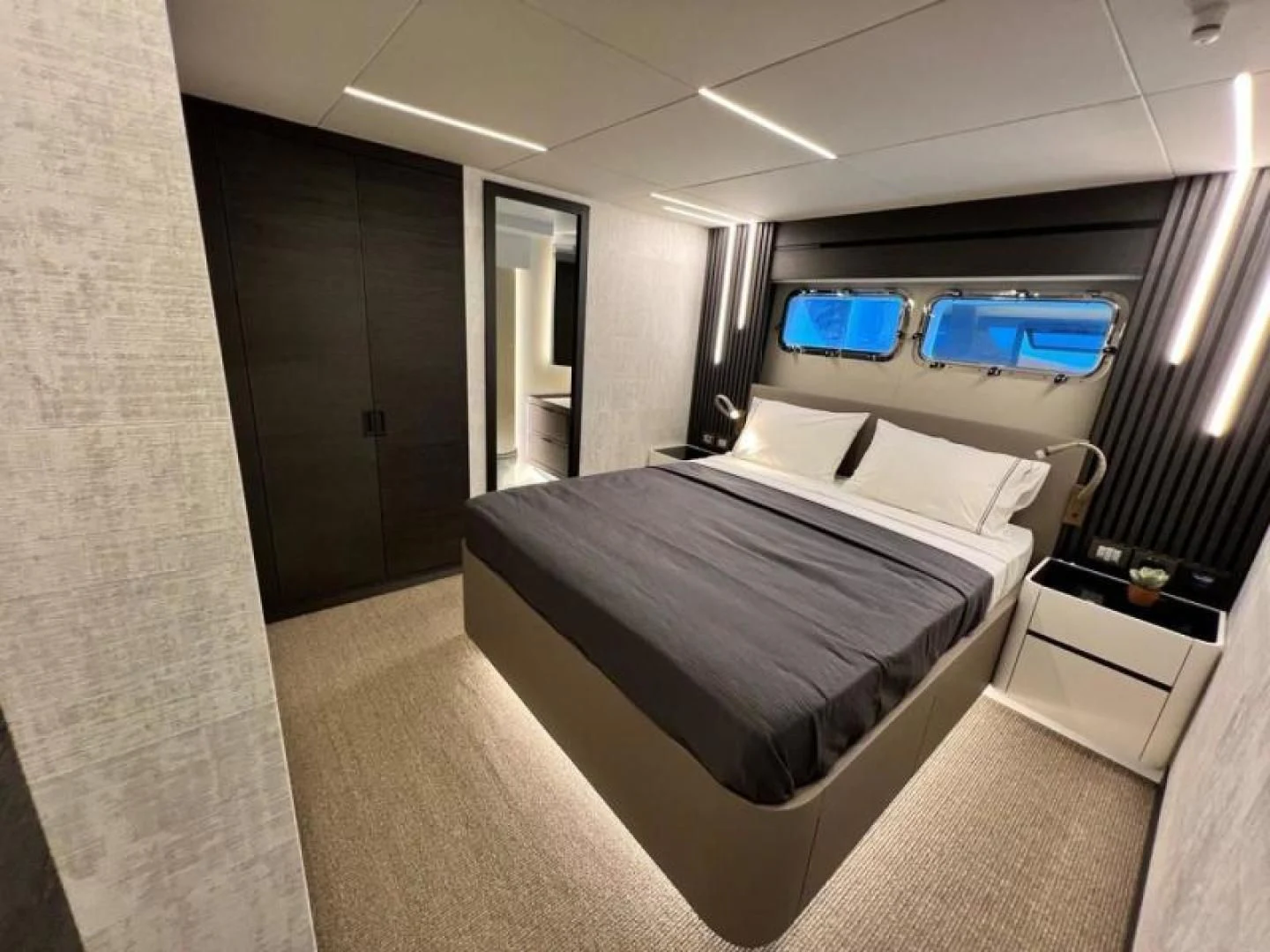 a room with a couple of beds aboard NUMARINE 22XP/07 Yacht for Sale