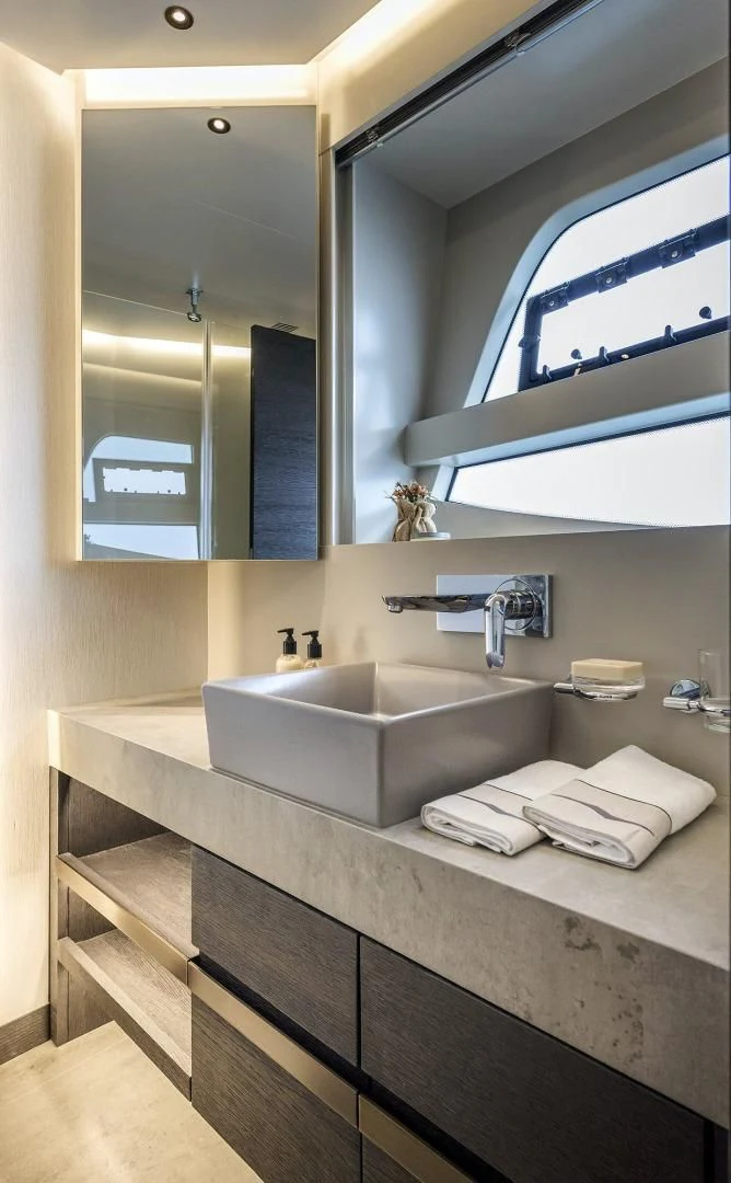 a bathroom with a large mirror aboard NUMARINE 22XP/07 Yacht for Sale