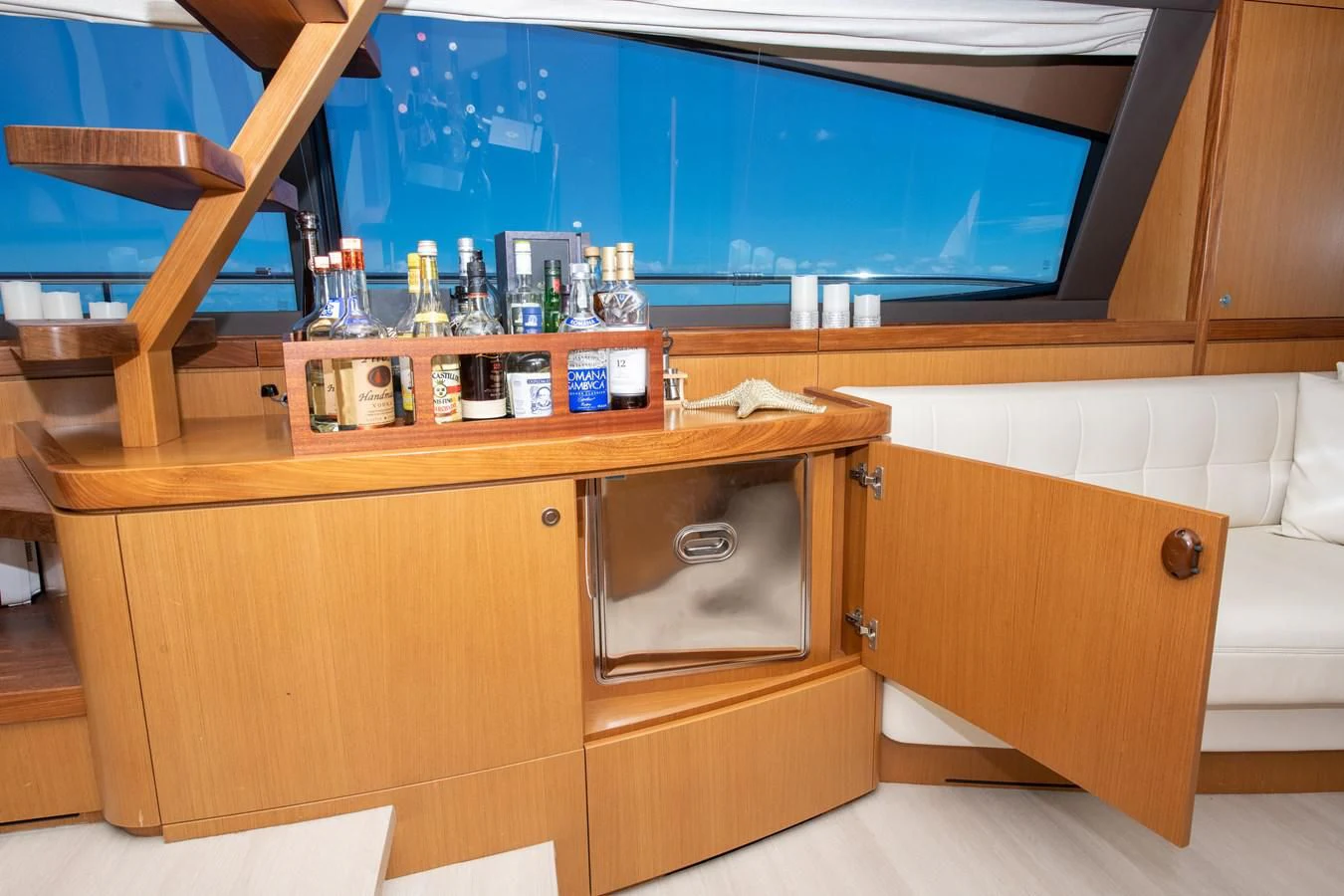 a room with a desk and a bed aboard HOPE Yacht for Sale