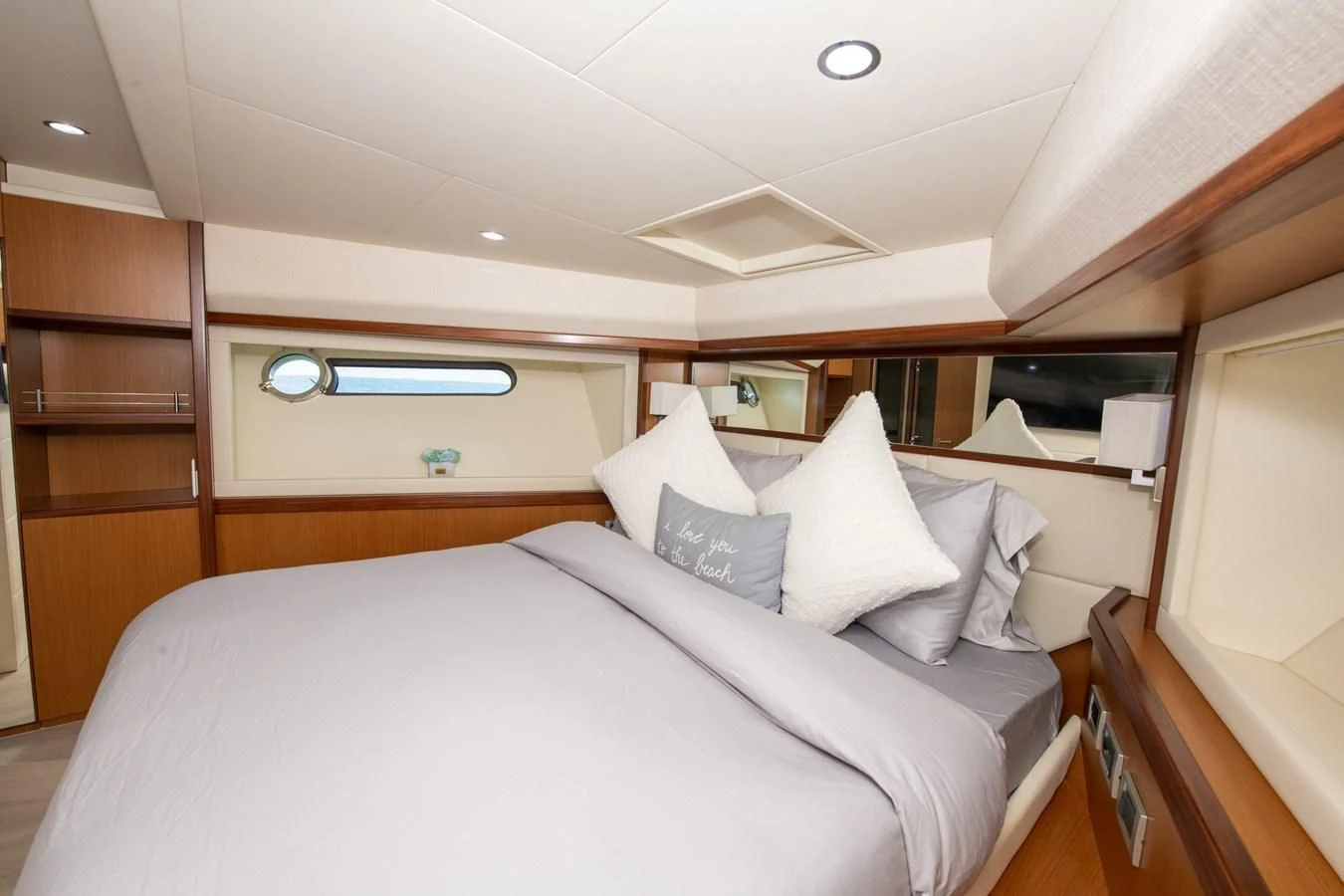 a bed with white sheets aboard HOPE Yacht for Sale
