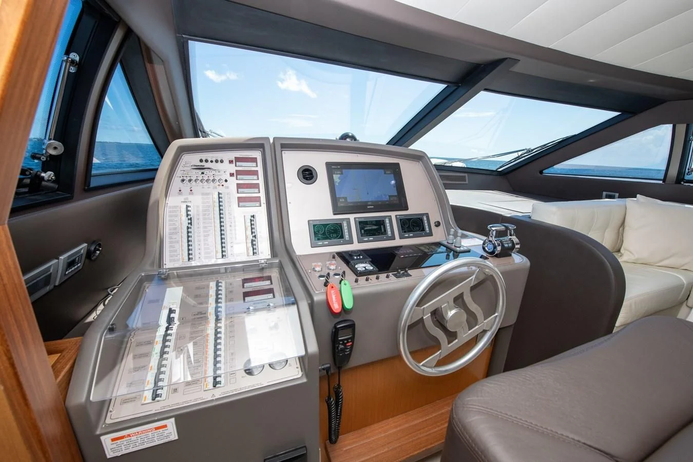 a car with a screen and a monitor on the side aboard HOPE Yacht for Sale