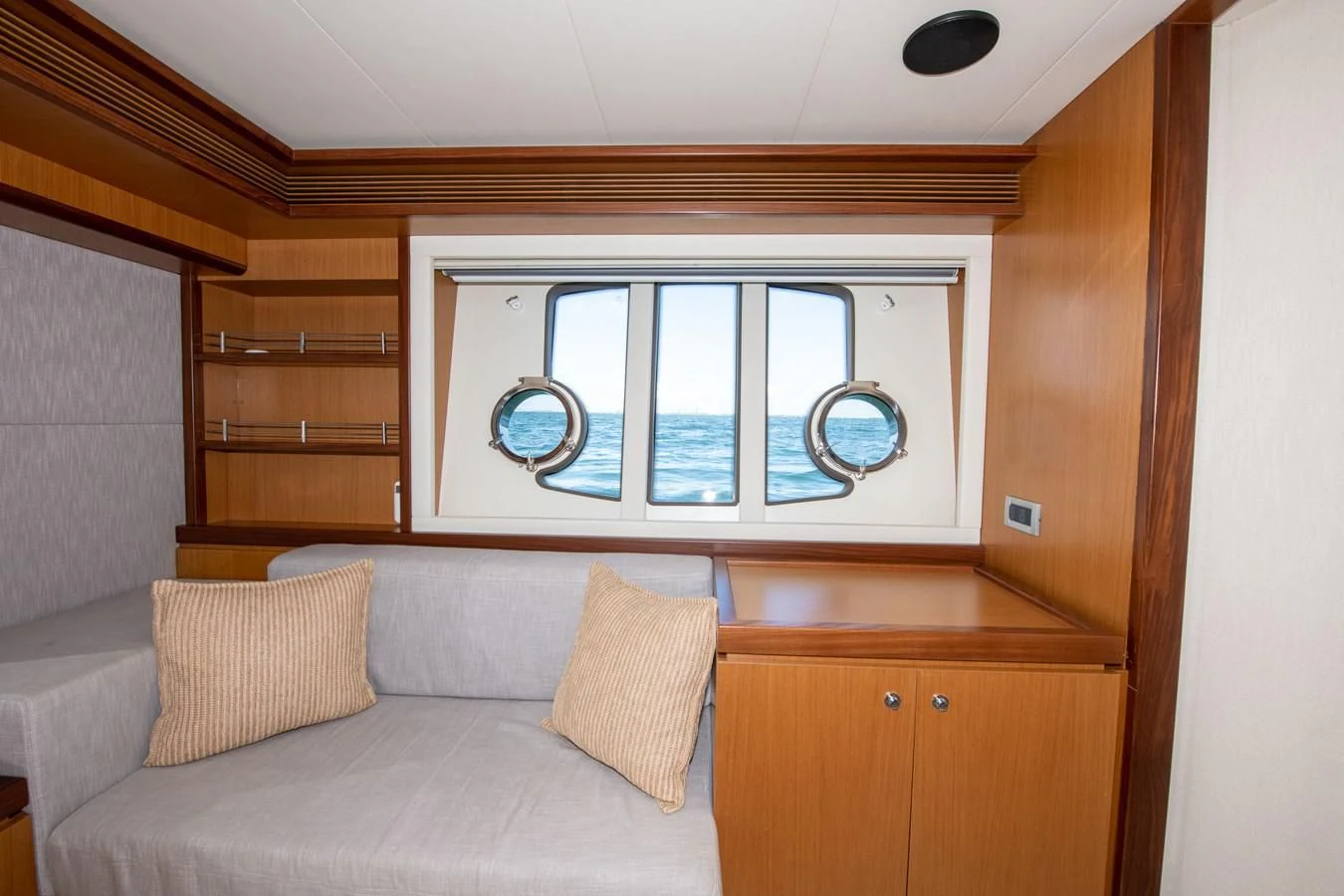 a room with a couch and a window aboard HOPE Yacht for Sale