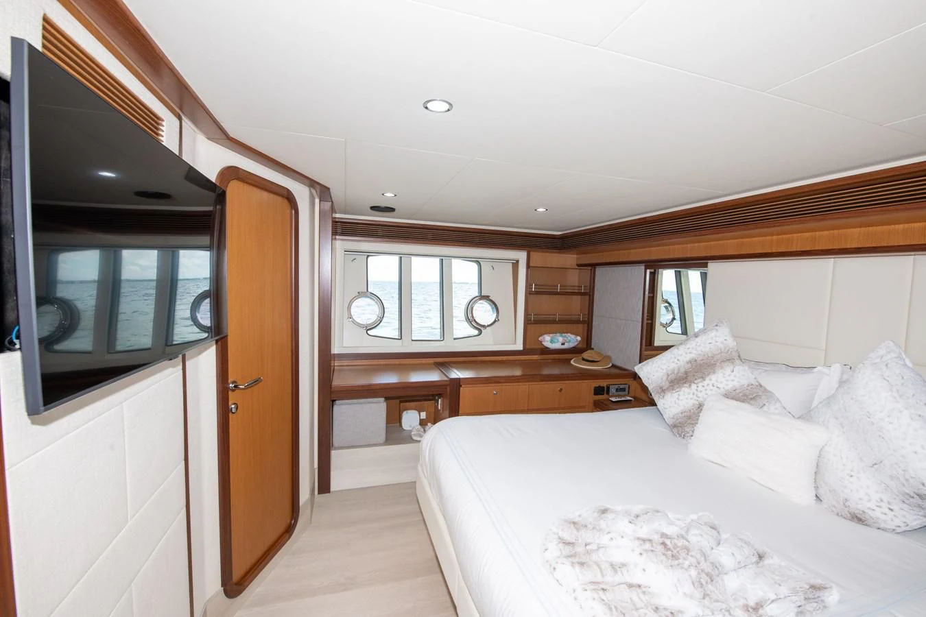 a bedroom with a bed and a desk aboard HOPE Yacht for Sale