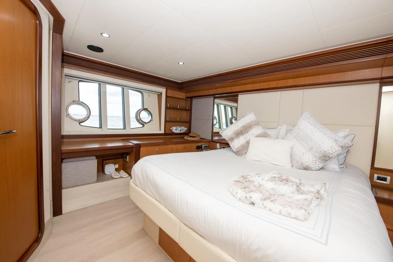 a bedroom with a bed and a desk aboard HOPE Yacht for Sale