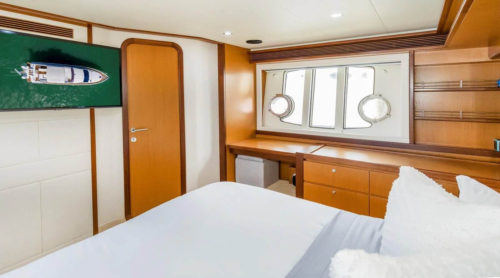 a bed with a white sheet aboard HOPE Yacht for Sale