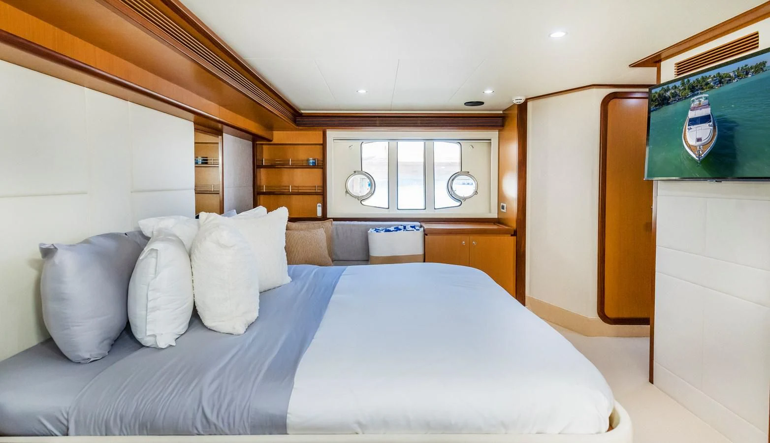 a bed with white sheets aboard HOPE Yacht for Sale