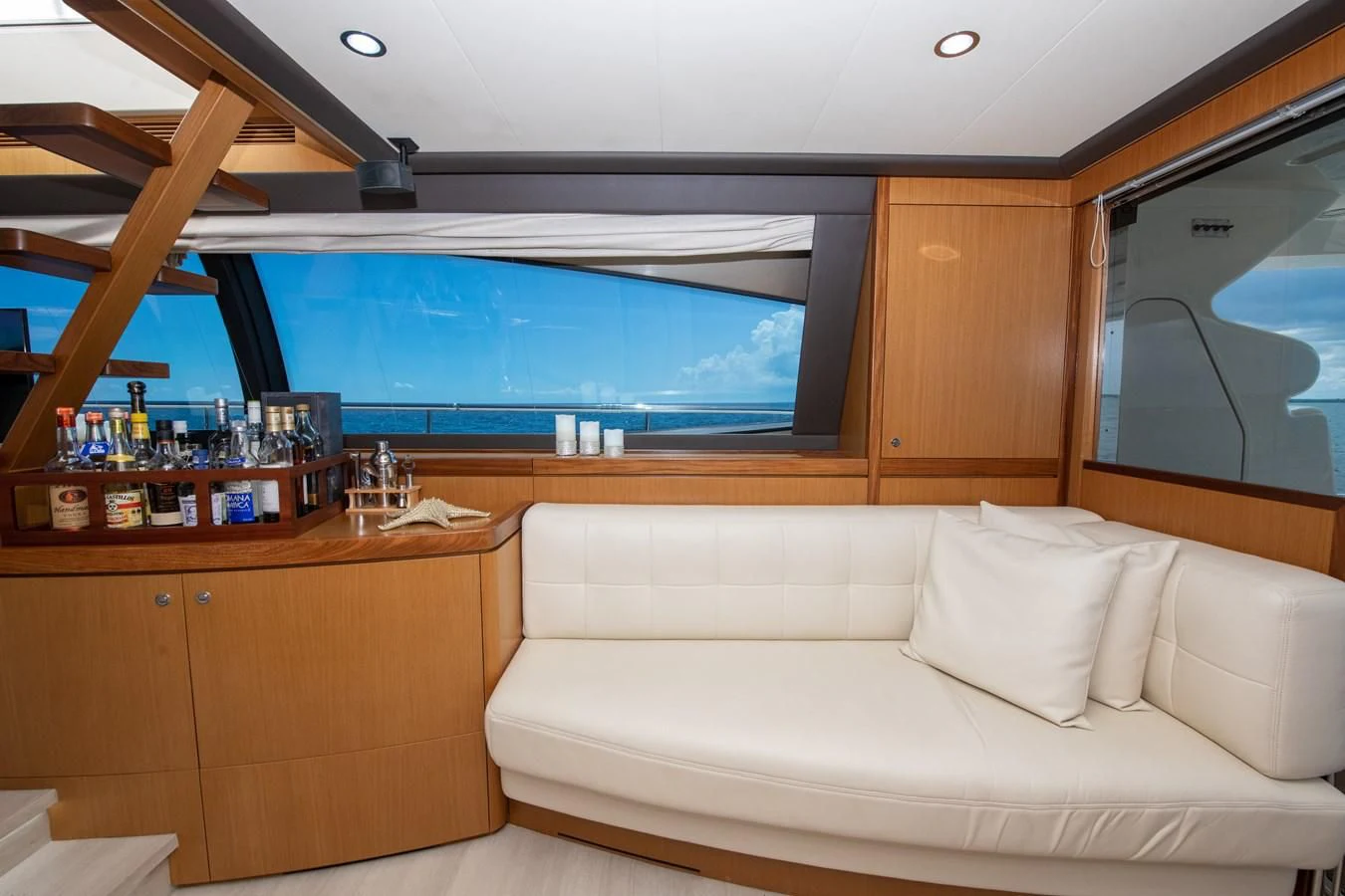 a room with a couch and a window aboard HOPE Yacht for Sale