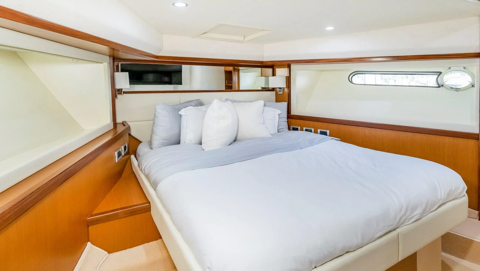 a room with a bed and a desk aboard HOPE Yacht for Sale