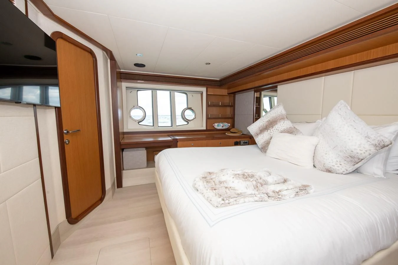 a bedroom with a bed and a desk aboard HOPE Yacht for Sale