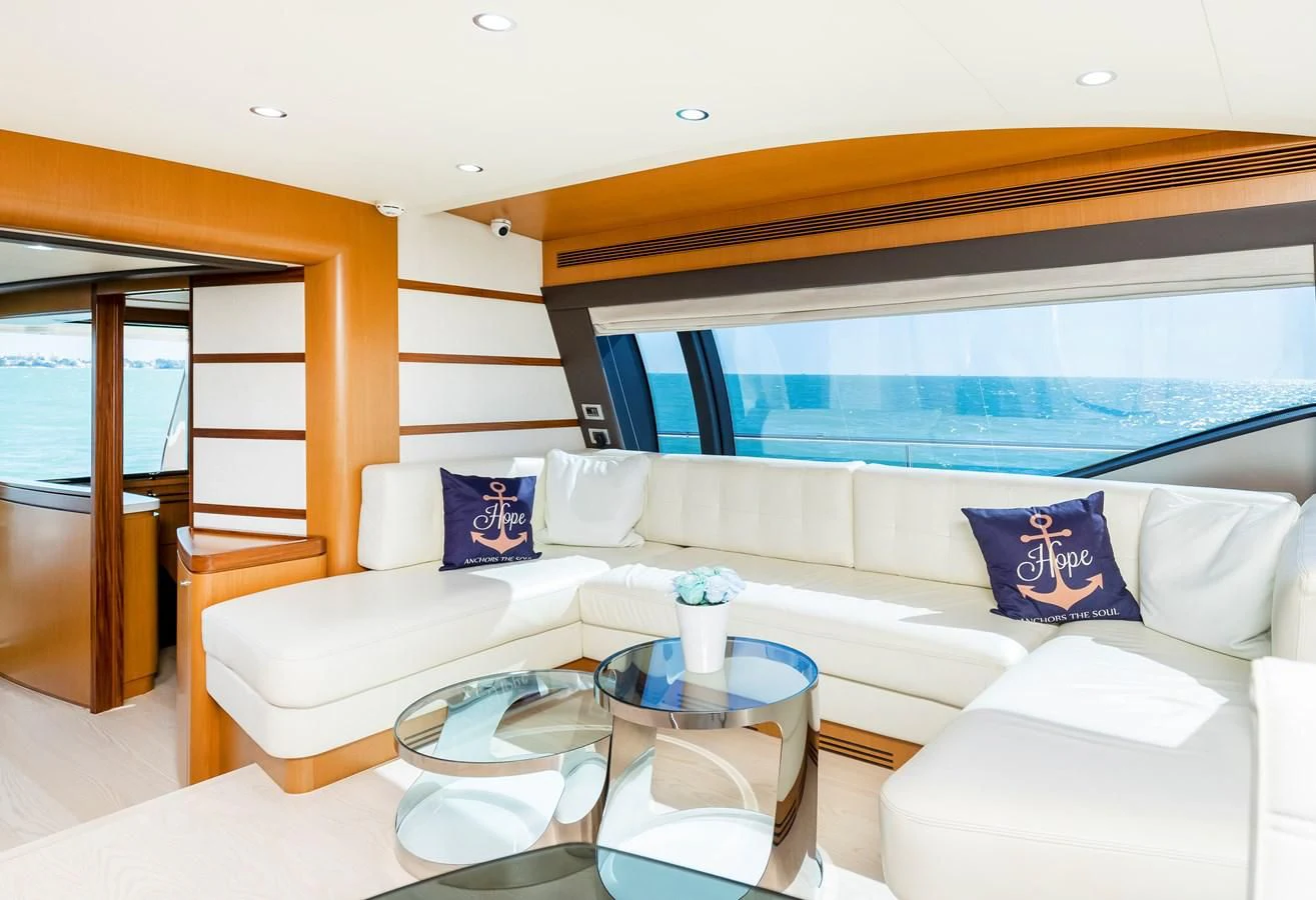 a living room with a large window aboard HOPE Yacht for Sale