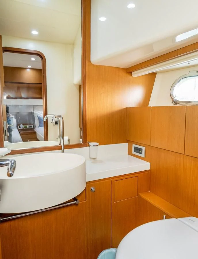 a bathroom with a sink and a mirror aboard HOPE Yacht for Sale