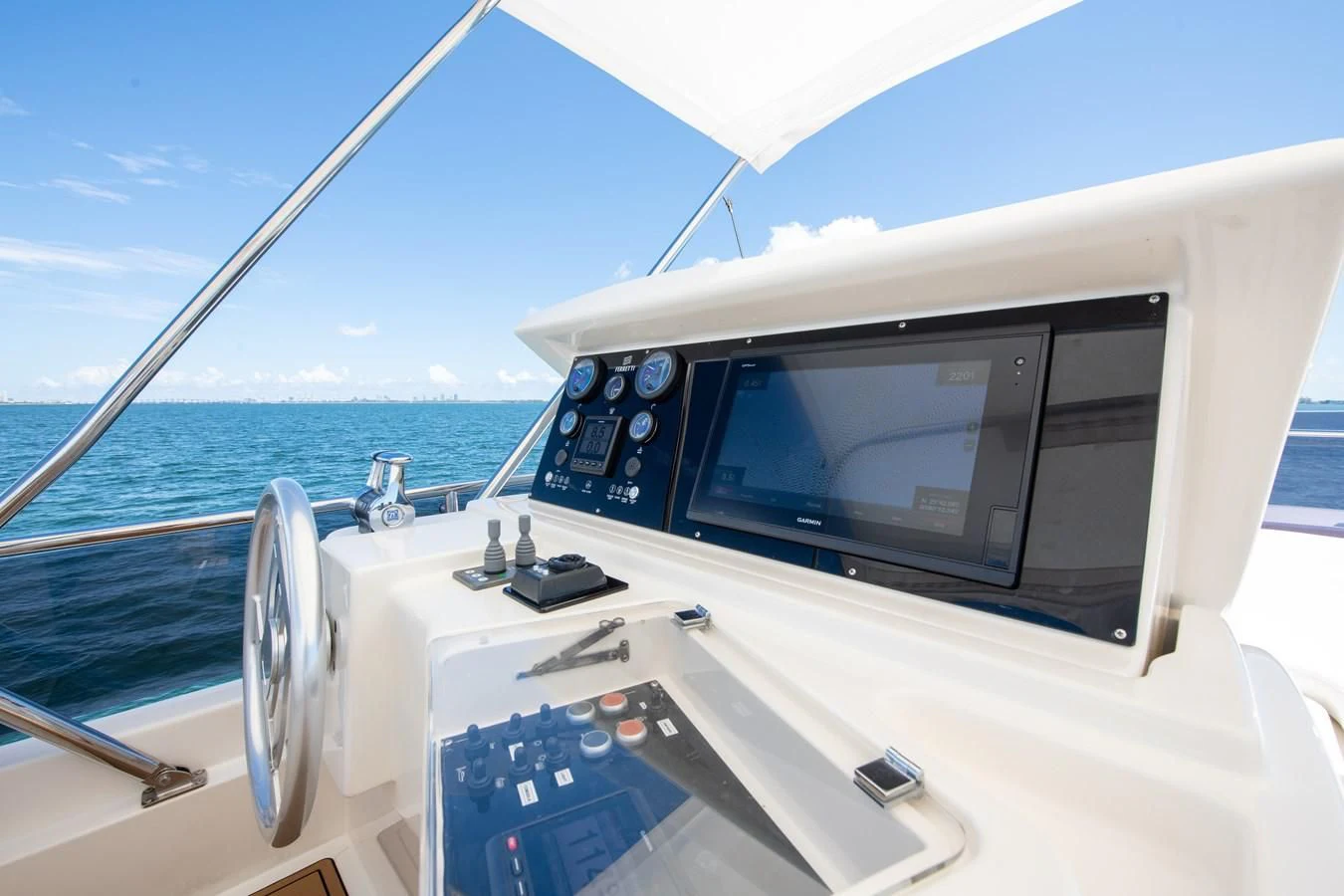 a boat with a screen and a steering wheel aboard HOPE Yacht for Sale