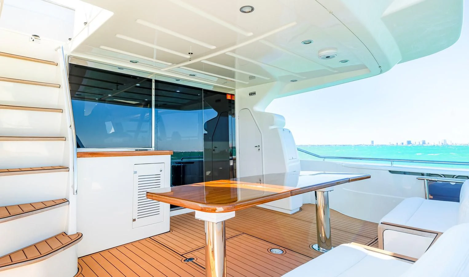 a room with a table and chairs aboard HOPE Yacht for Sale