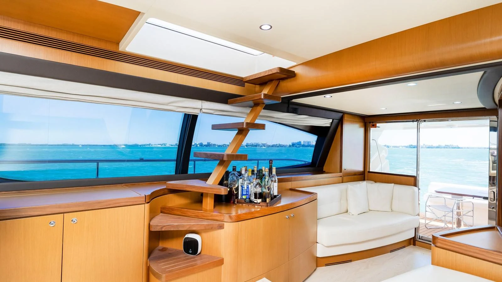 a room with a table and a couch aboard HOPE Yacht for Sale