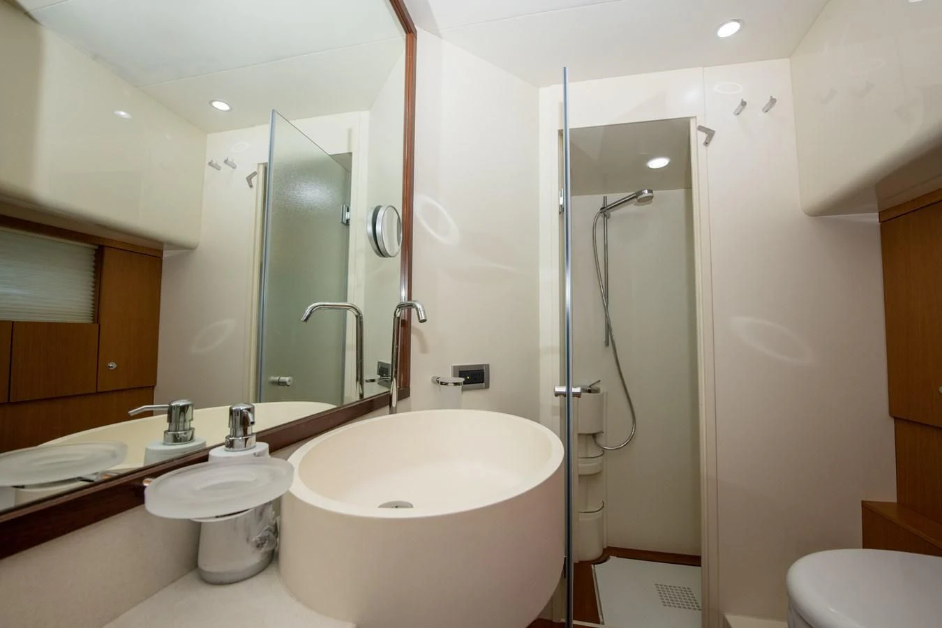 a bathroom with a glass shower aboard HOPE Yacht for Sale