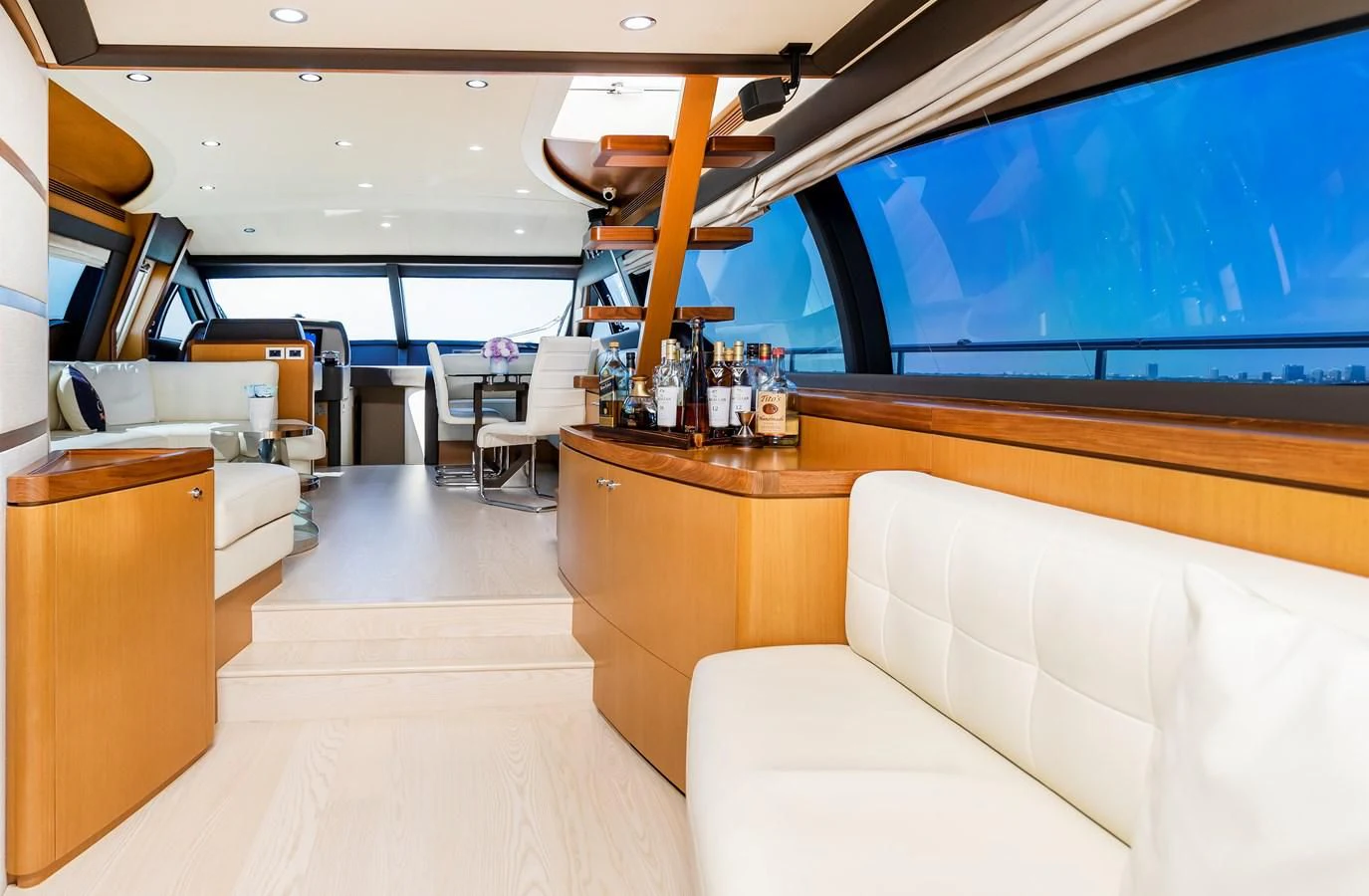 a room with a couch and a table and chairs aboard HOPE Yacht for Sale