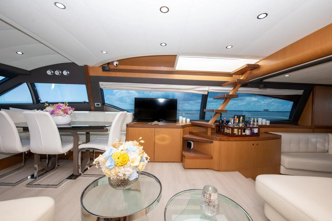 a room with a table and chairs aboard HOPE Yacht for Sale