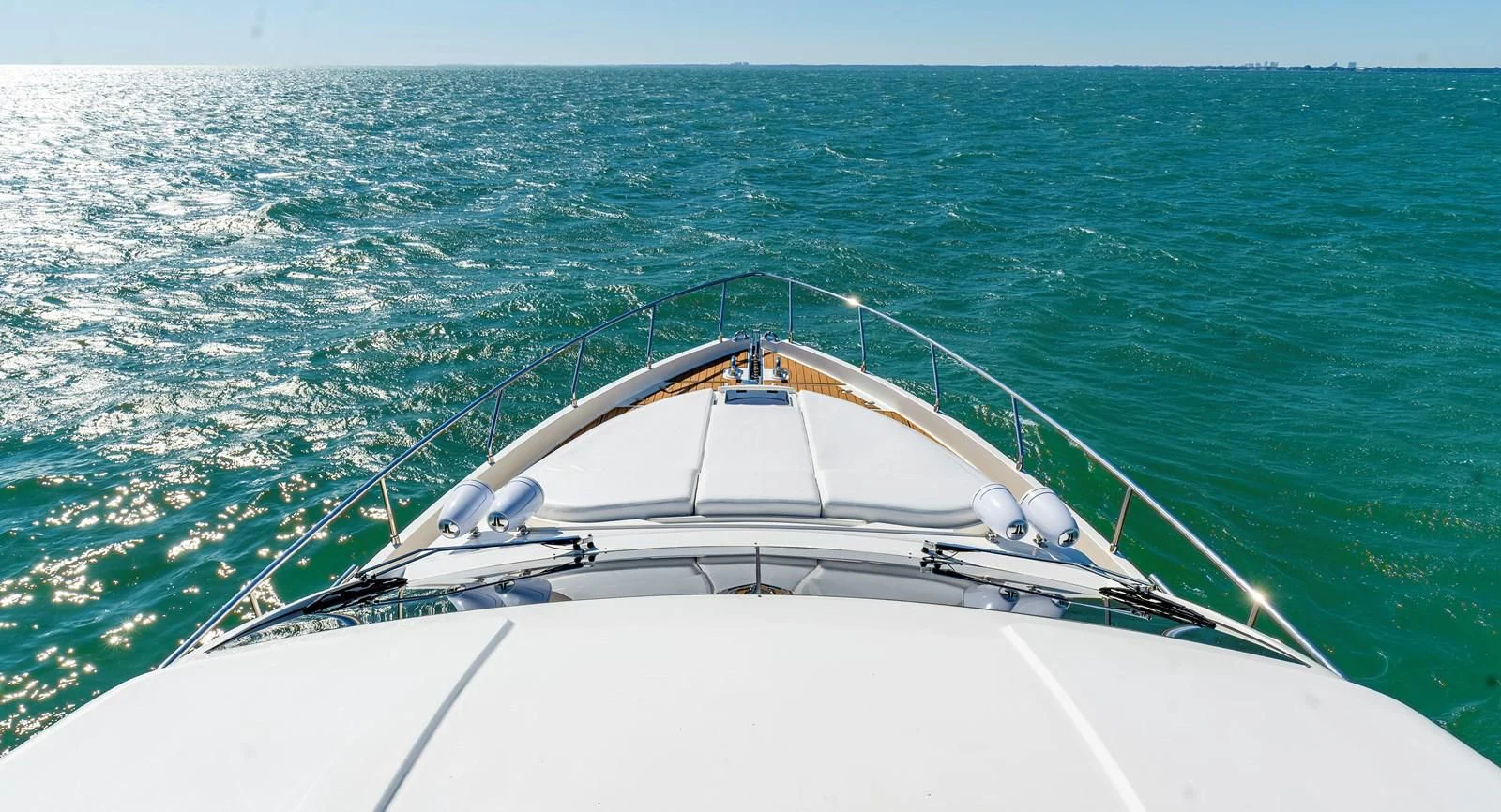a white boat in the water aboard HOPE Yacht for Sale