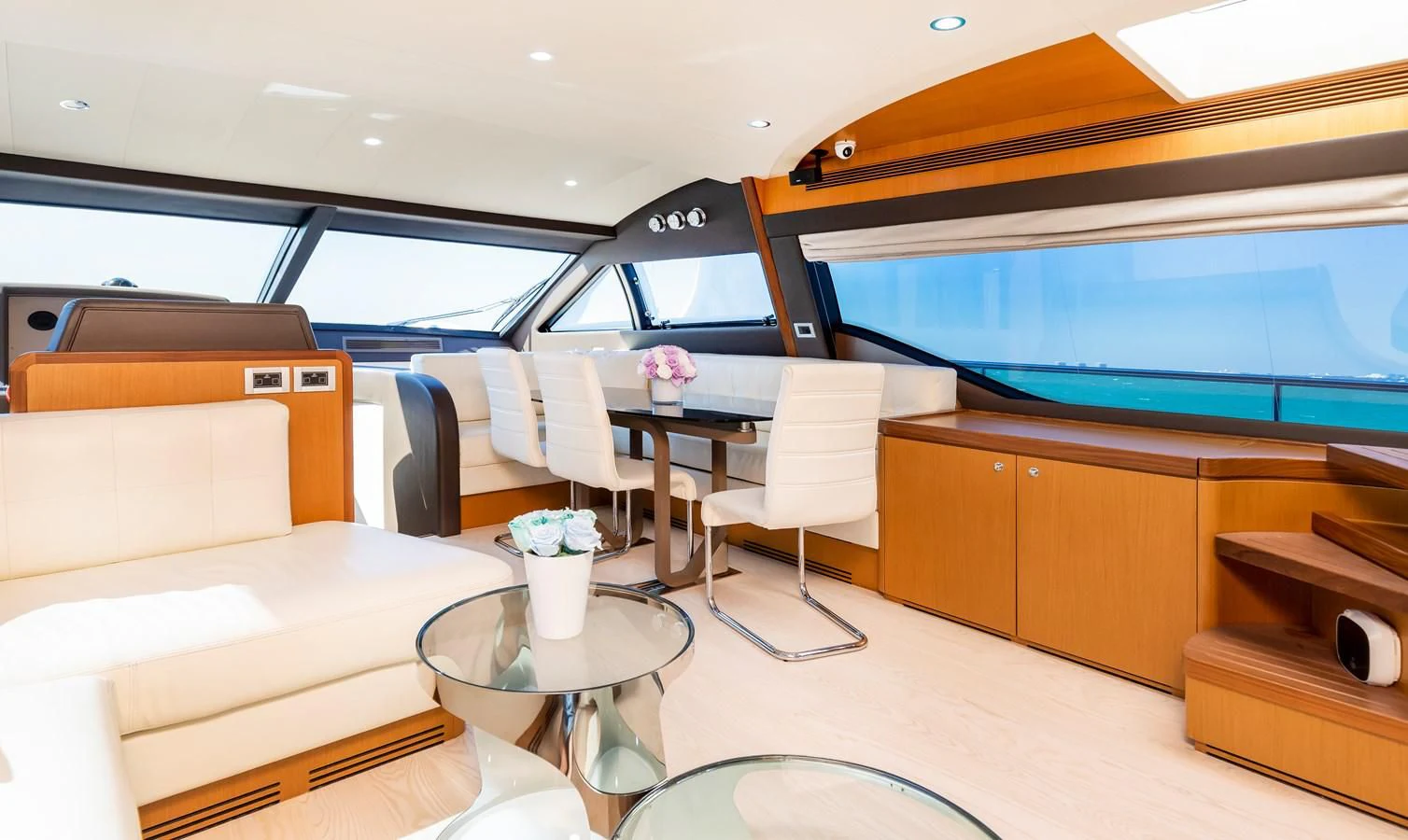 a room with a table and chairs aboard HOPE Yacht for Sale