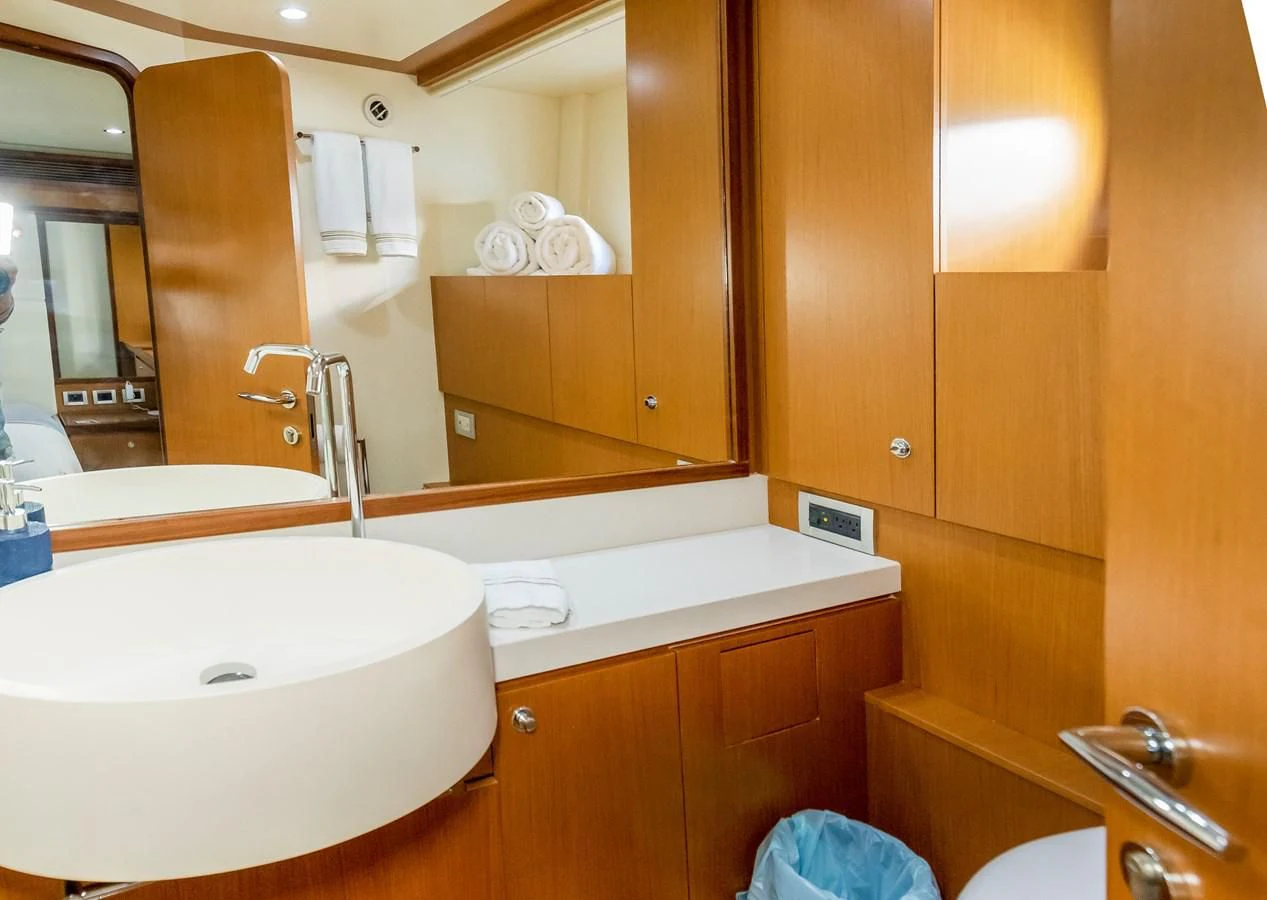 a bathroom with a large mirror aboard HOPE Yacht for Sale