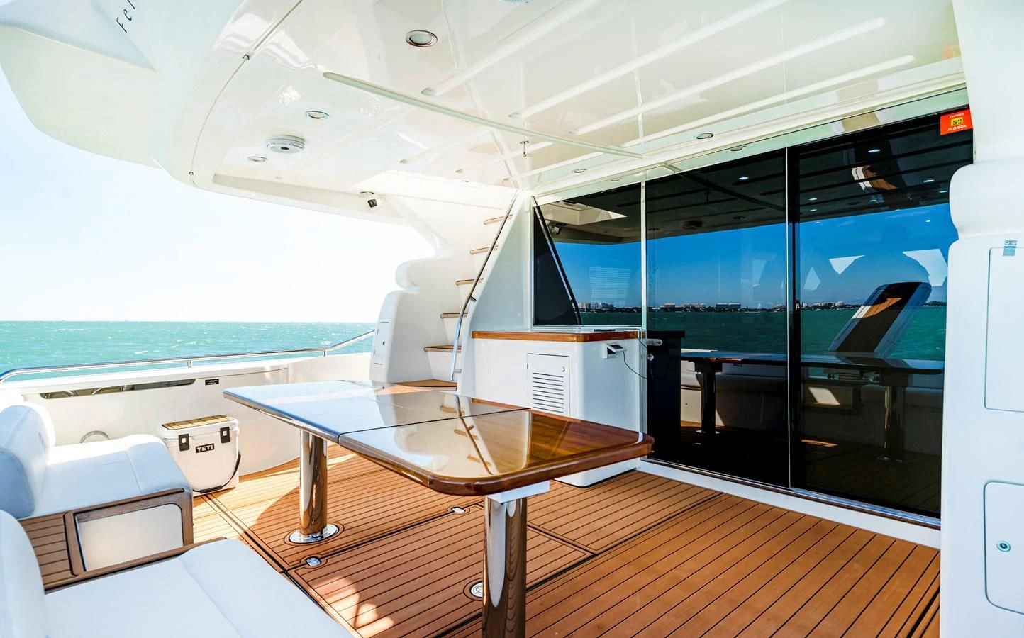 a room with a table and chairs aboard HOPE Yacht for Sale
